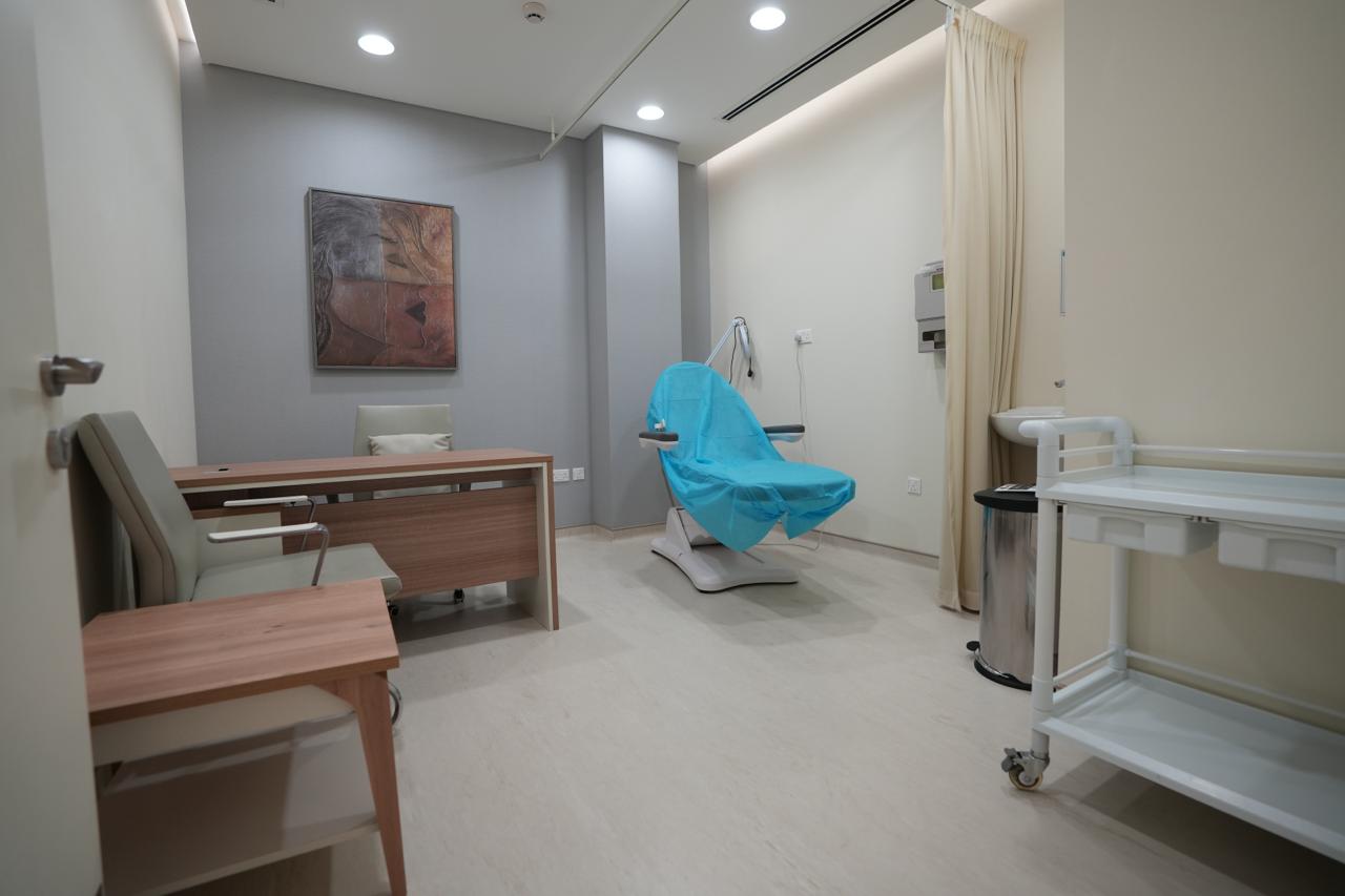 Consultation room with examination couch and equipment trolley in a Dubai clinic