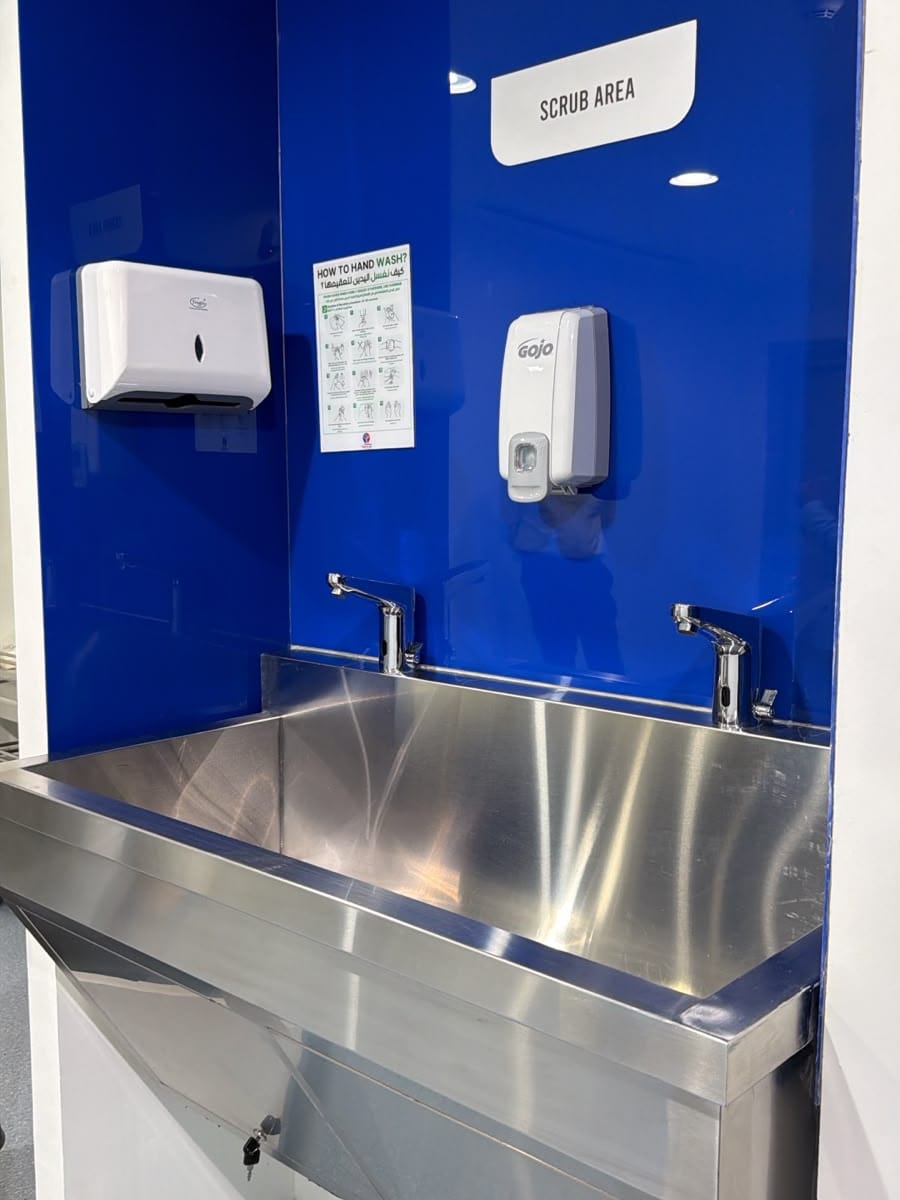 Surgical scrub area with stainless steel scrub sink in a day surgery centre in Jumeirah, Dubai