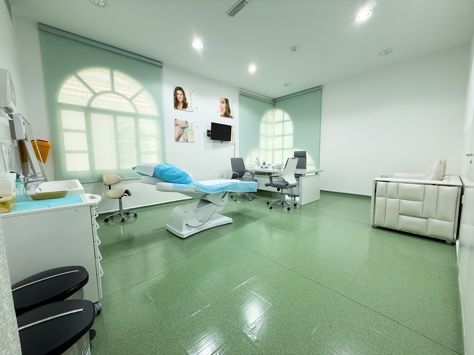 Aesthetics consultation room with treatment couch in a poly clinic in Jumeirah, Dubai