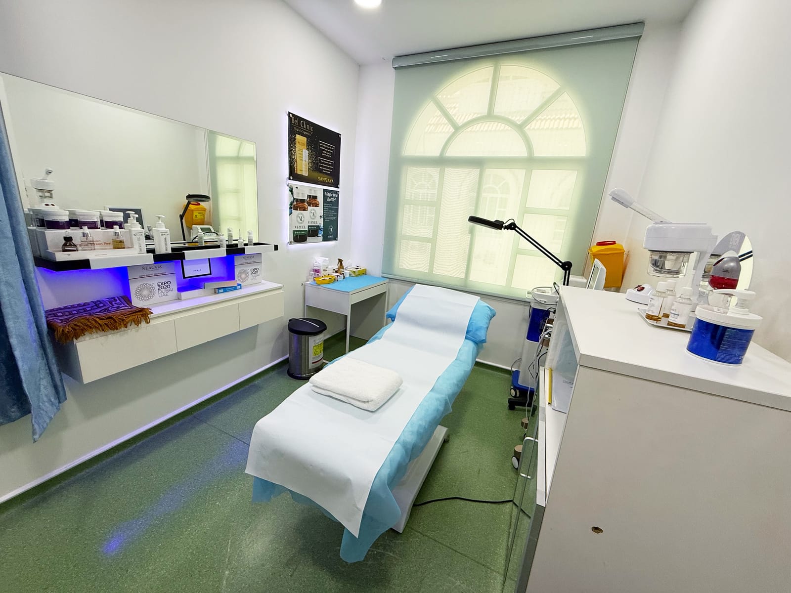 Aesthetics treatment room with treatment couch and skincare station in a poly clinic in Jumeirah, Dubai