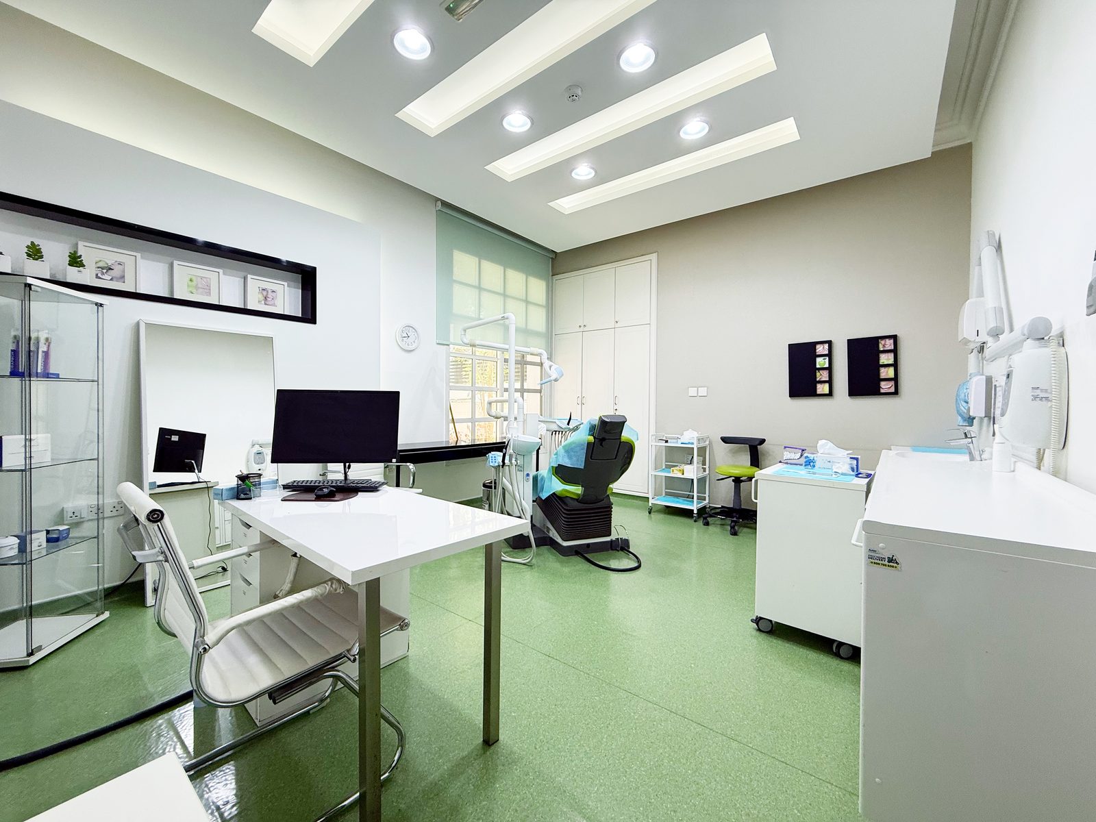 Consultation room with workstation and treatment chair in a poly clinic in Jumeirah, Dubai