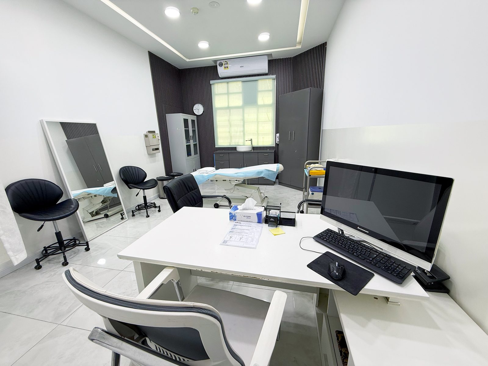 Consultation room with doctor's workstation in a poly clinic in Jumeirah, Dubai
