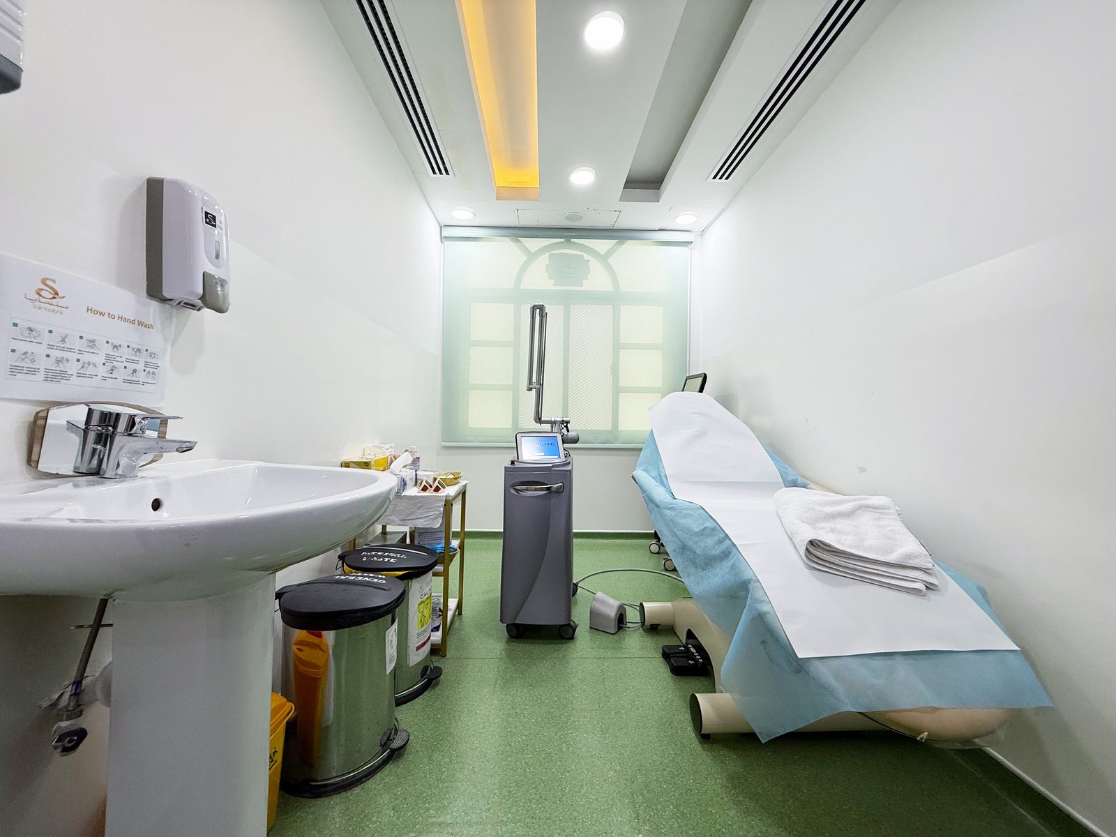 Laser treatment room with treatment bed in a poly clinic in Jumeirah, Dubai