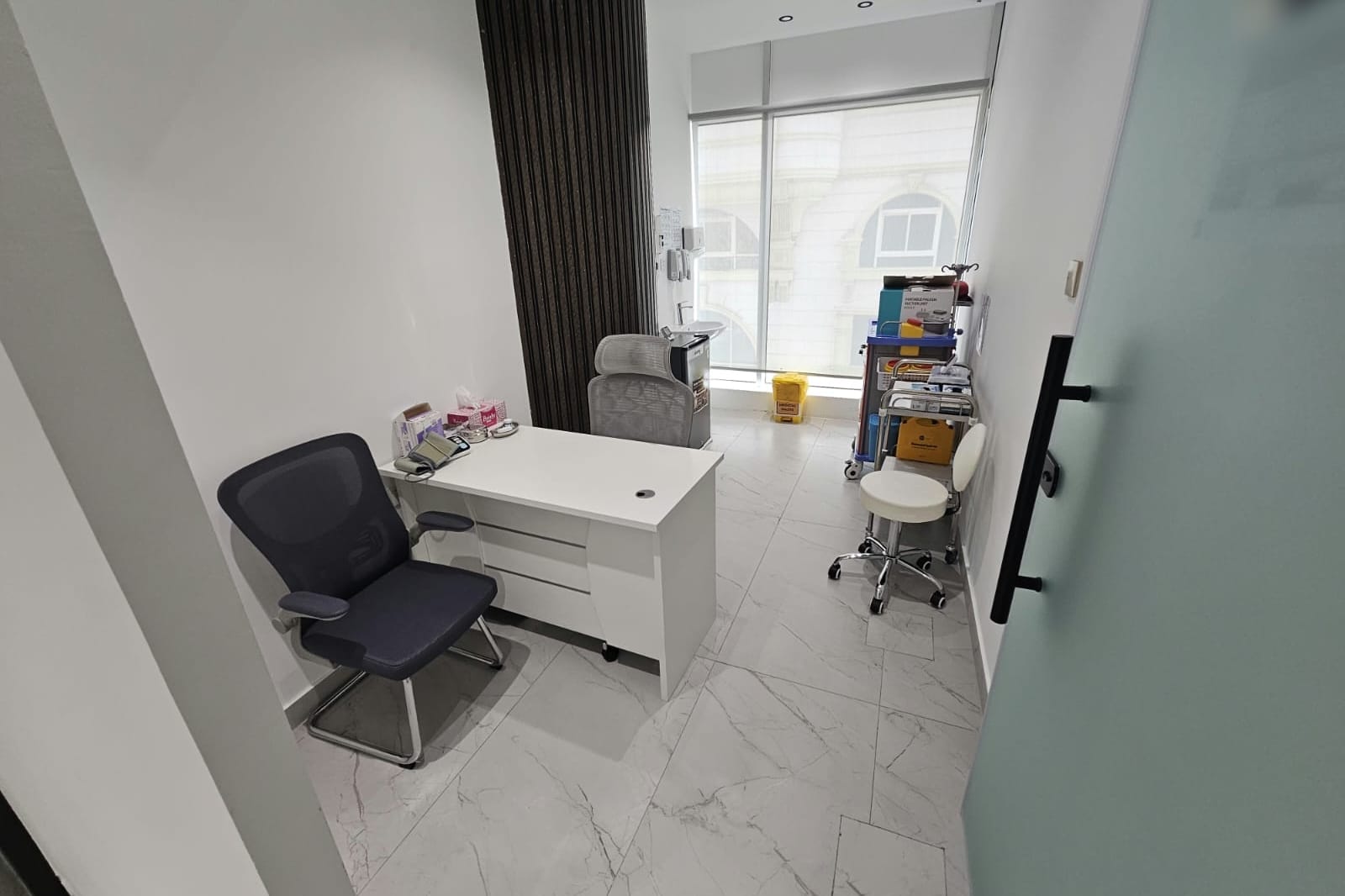 Vital signs and nursing assessment room with emergency trolley in a medical centre in Al Danah, Abu Dhabi